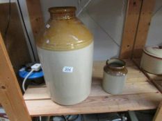 A large stoneware jar and one other