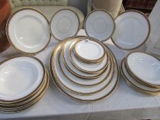 Approximately 28 pieces of Royal Doulton gold rimmed dinner ware