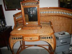 A cane dressing table,