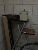 A vintage slide projector, stand,