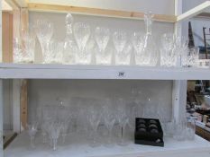 2 Shelves of crystal glass ware including decanters, wine glasses, whiskey tumblers etc.