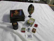 A lacquered box with painted portrait A/f, a lacquered pill box, A lacquered egg,