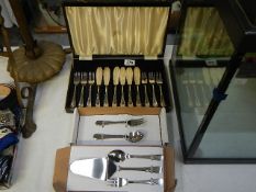 A cased set of fish knives and forks together with other cutlery
