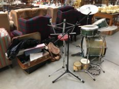 A Premier bass, snare and tom drums and bongo drums with cymbals, stands etc.