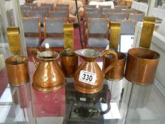 A set of 4 copper measures and 2 others