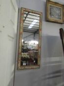 A floral framed mirror