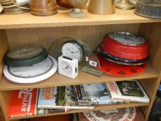 A shelf of assorted clocks