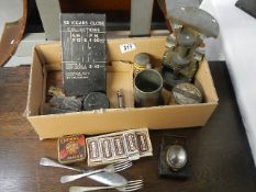 An interesting collection of tins, plaques, bike light,