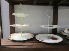 A Swinnertons Nestor Vellum 2 tier cake stand and a 3 tier cake stand of assorted plates