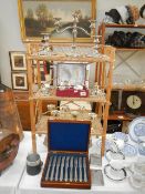 A mixed lot of silver plate and a bamboo shelf unit