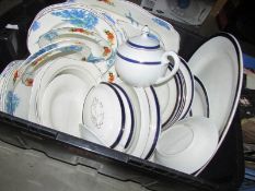 A box of assorted dinnerware