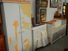 A children's bedroom suite including cot,