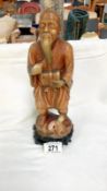 A resin figure of an oriental peasant