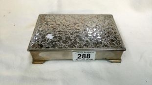 A silver plated cigarette box