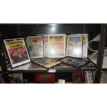 A quantity of framed & glazed comic covers