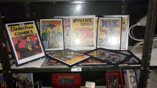 A quantity of framed & glazed comic covers