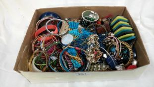 A box of costume jewellery including bangles