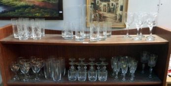 2 shelves of glasses including water jug set