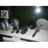 A quantity of dumbbells and weights