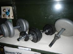 A quantity of dumbbells and weights