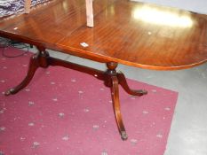 A mahogany twin pedestal table