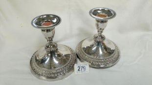 A pair of silver plated candlesticks