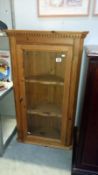 A pine corner cabinet