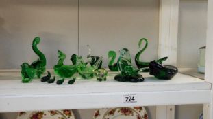 A quantity of green glass animals