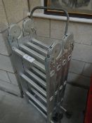 An aluminium ladder and trolley