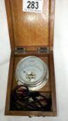 A volt meter in wooden case