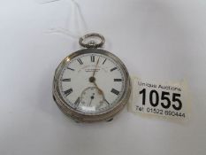 A silver packet watch marked 'The Express English Lever' J. G.