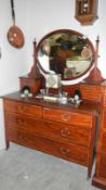 A mahogany inlaid dressing table