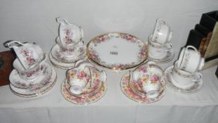A part Royal Albert Serena tea set consisting of 6 cups/saucers & cake stand etc and 2 other part