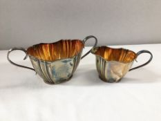 A silver Walker & Hall cream jug and sugar bowl,