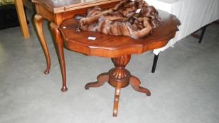 A mahogany central pedestal occasional table
