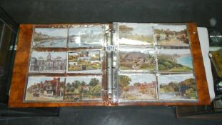 An album of approx 200 postcards including Alfred Robert Quinton, Mabel Lucie Attwell,