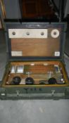 A wooden box marked Leak Locator Outfit B WCI52766 with contents