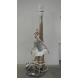 A large NAO figural table lamp of a girl