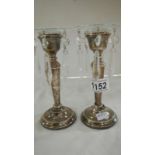 A pair of hallmarked candlesticks