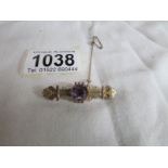 A Victorian gold bar brooch set amethyst