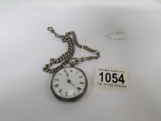A silver pocket watch on chain