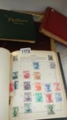 A box of 4 stamps albums