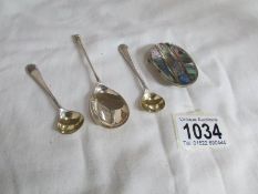 3 silver spoons and a white metal buckle set paua shell