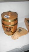 A vintage brass bound oak barrel Wilsons snuff shop display container and bags