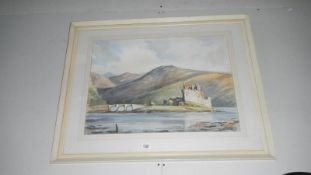 A large framed and glazed watercolour of Eilean Donan by Fred Statt