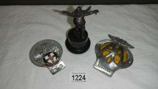 A 1920s Skegness Jolly Fisherman car mascot and a Lincolnshire car badge and a AA badge