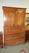 A mahogany linen press being 2 doors over 3 drawers