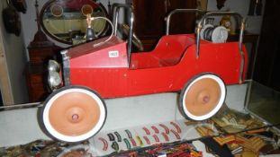 A vintage style fire engine pedal car