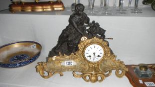 A French spelter and brass ormolu mantel clock