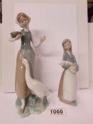 2 Lladro figures being a girl with a goose and a girl with a piglet